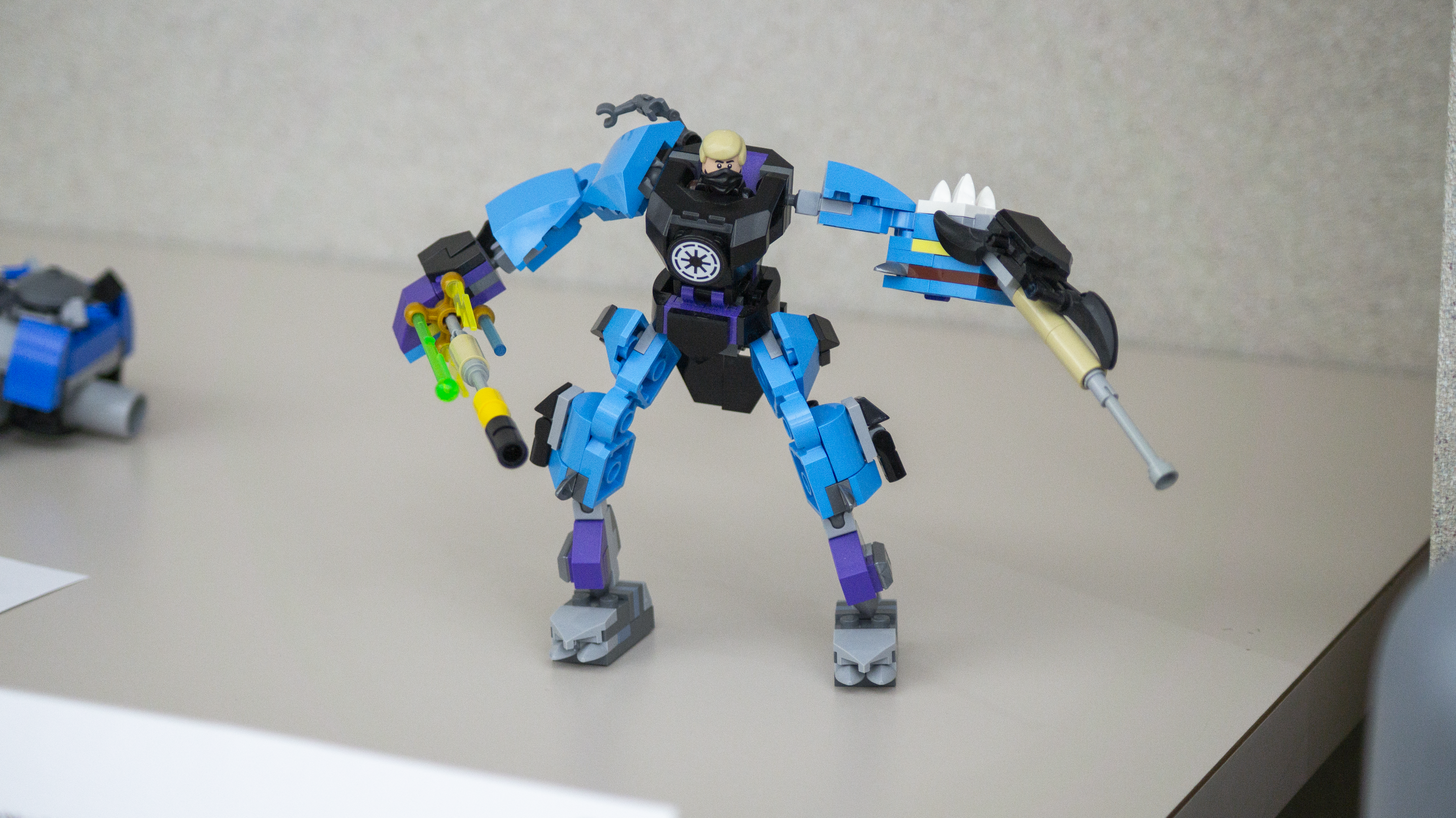 Photo of a Lego creation. A blue robot figure.