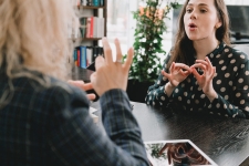woman learning or speaking in ASL