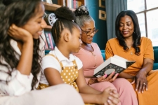 multigenerational family reading together