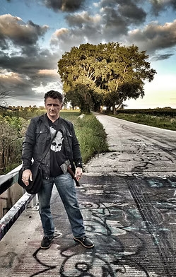 Photo of author Chad Lewis standing on a country road. 