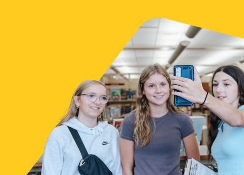 Teens pose for a photo