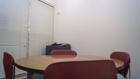4 chairs seated around a table in multipurpose room 2