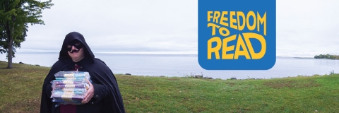 Freedom to Read banner title image shows the Banned Book Bandit holding books in front of the lake