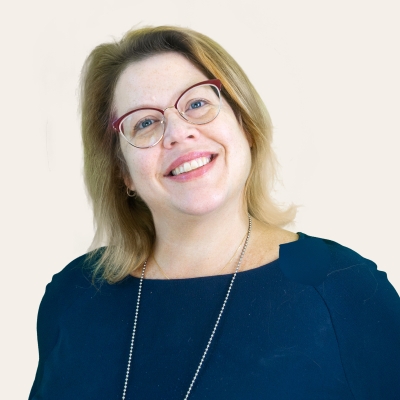 Headshot photo of Sandy, OPLs Community Engagement Librarian. 